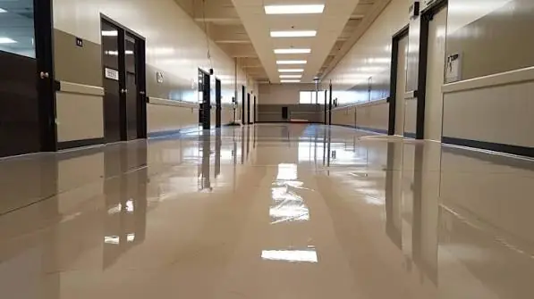 Freshly stripped and waxed hallway floor with a high gloss finish