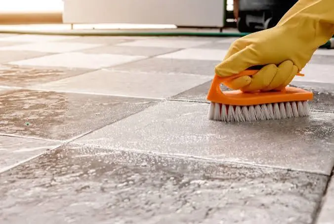 Scrubbing outdoor tile during exterior cleaning